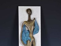 Lyrical  As a wall-hanging 'Lyrical' is mounted on a backing of white Corian.  The figure springs from a found tree root and is suggestive of the elements needed to sustain growth earth, sun and water. 23 x 10 inches   $750.00